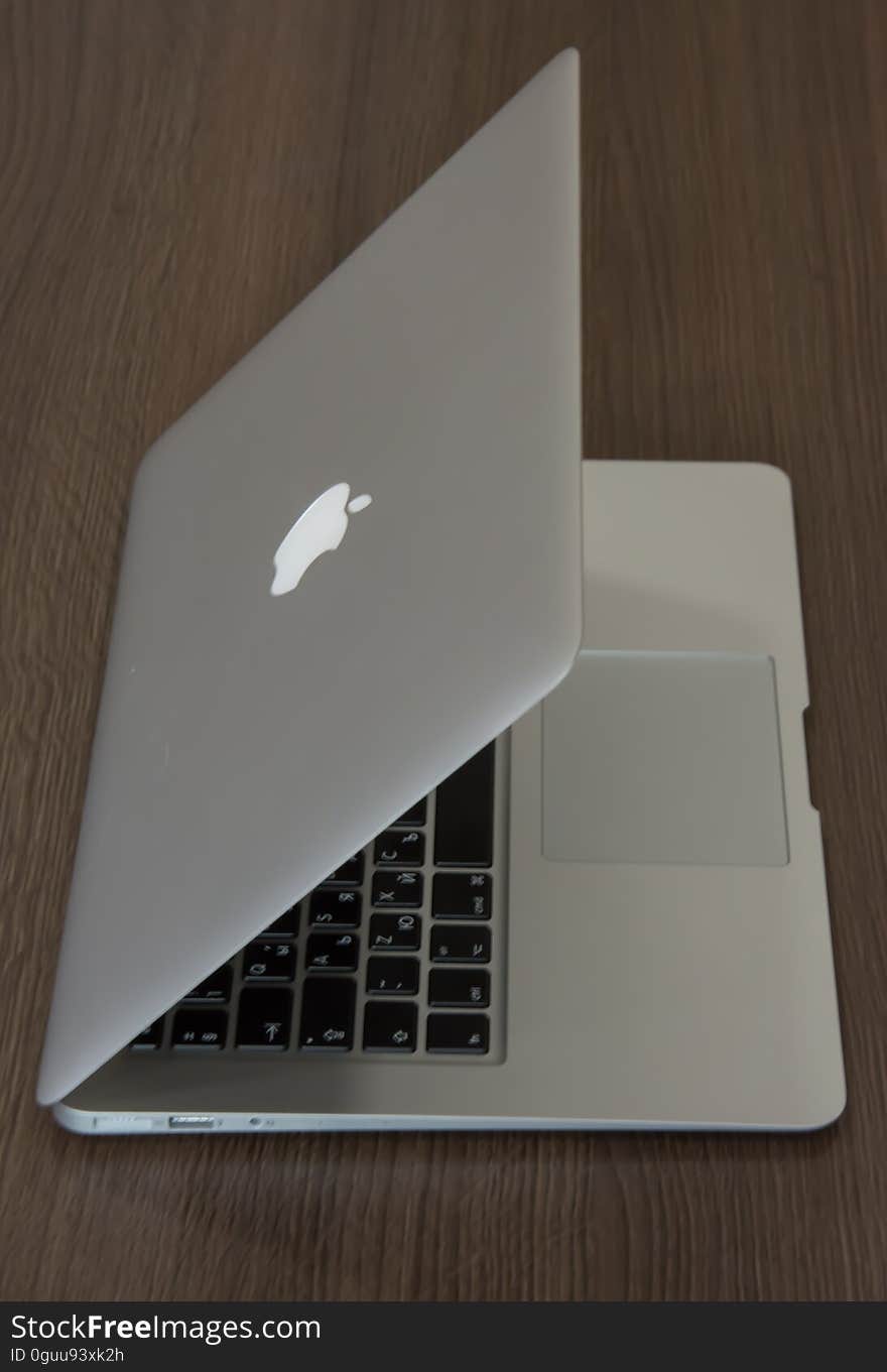 An Apple Macbook on a desk.