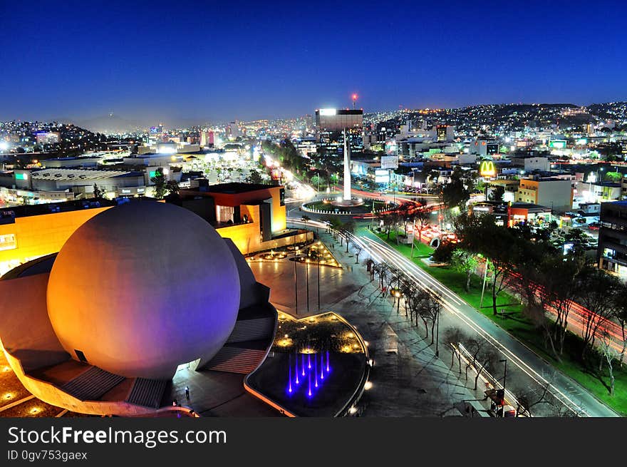 Tijuana cityscape at night with the arts and cultural centre in the background.