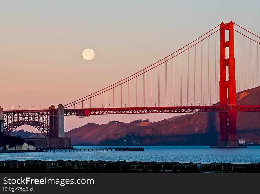 The Golden Gate bridge and the full moon.