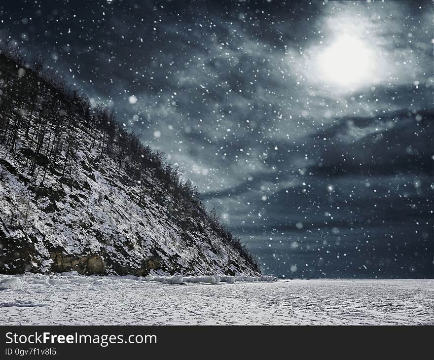 Scenic View of Snow Covered Landscape Against Sky