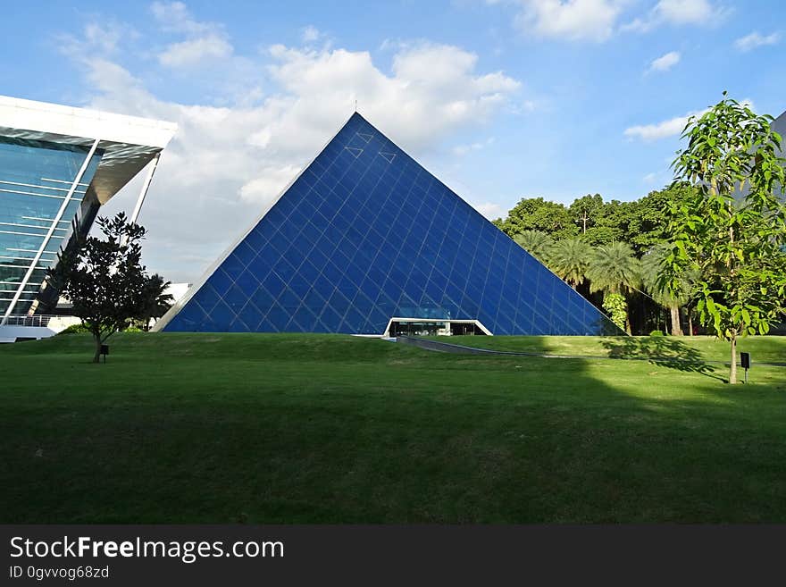 The exterior of a glass pyramid.