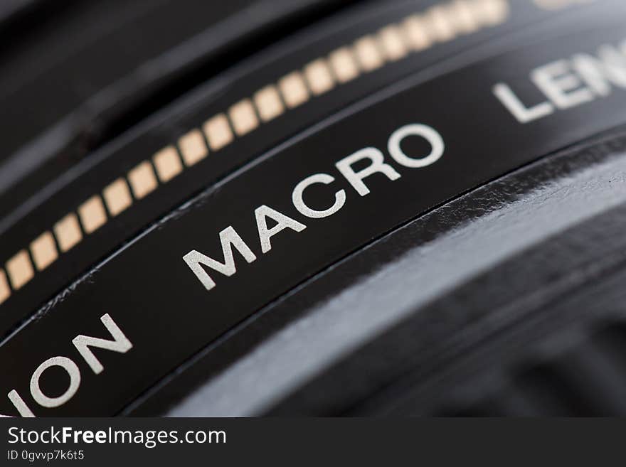 A close up of a macro lens on a professional camera.