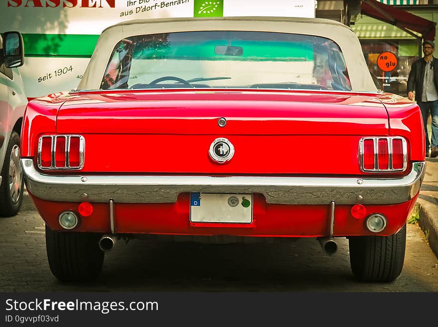 The rear of an old classic automobile. The rear of an old classic automobile.