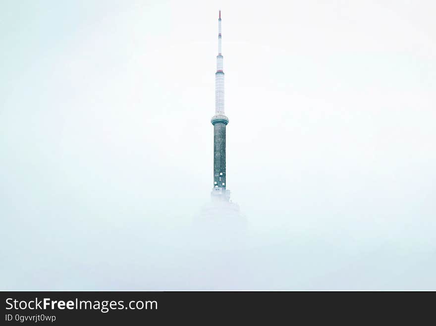 A tower peeking from the mist. A tower peeking from the mist.