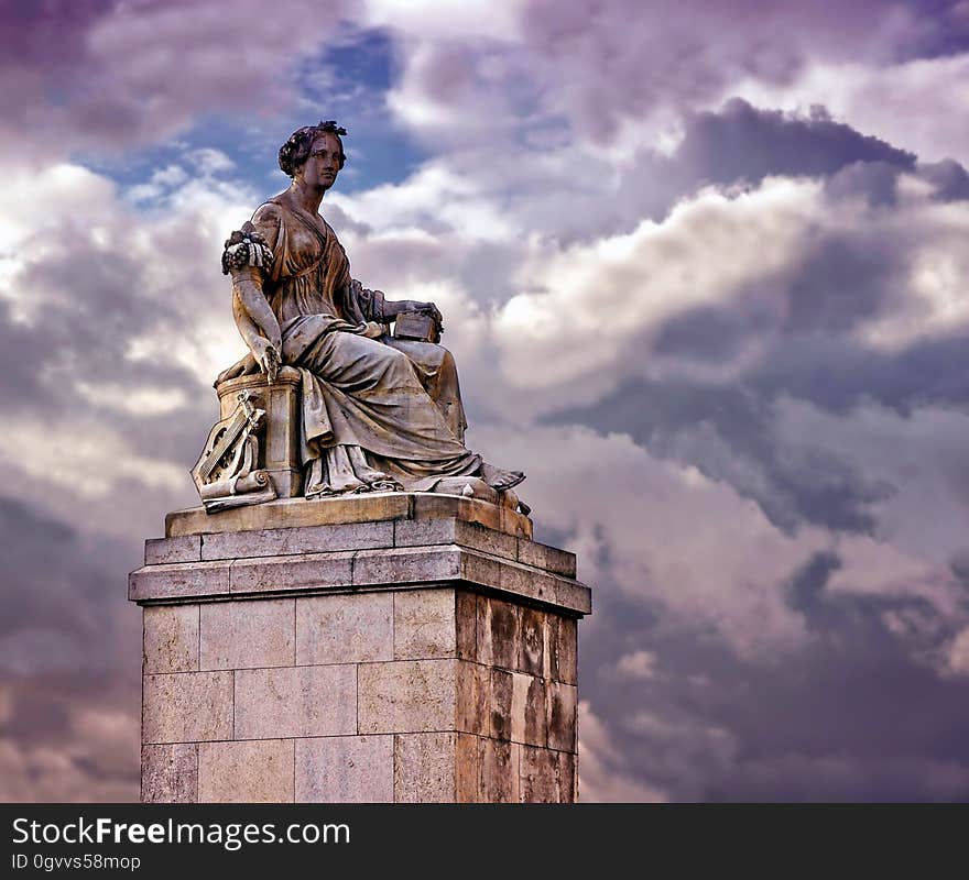 Person in White Dress Ceramic Statue Under Blue Cloudy Sky during Daytime