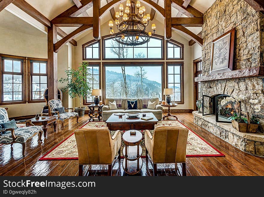 A living room on a mountain cabin with rustic style.