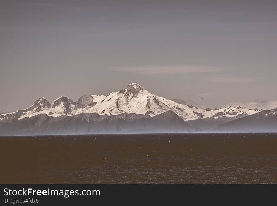 The sea and snowcapped mountain peaks in the background. The sea and snowcapped mountain peaks in the background.