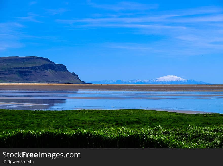 Sea landscape with mountains in the horizon.