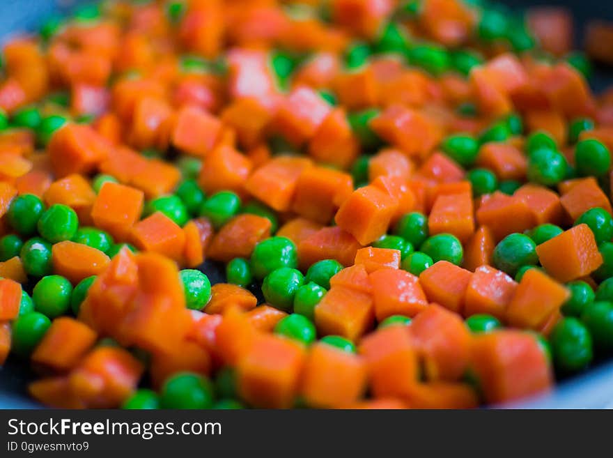 Diced carrots with green peas in a pot. Diced carrots with green peas in a pot.