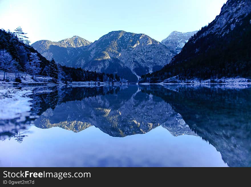 Mountains reflecting from the surface of a lake. Mountains reflecting from the surface of a lake.