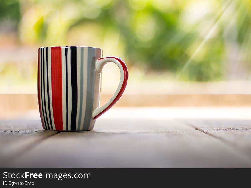 A close up of a striped tea mug. A close up of a striped tea mug.