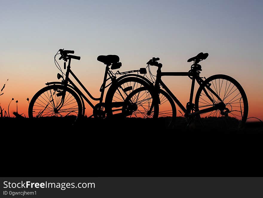 Silhouette of bicycles in countryside at sunset. Silhouette of bicycles in countryside at sunset.