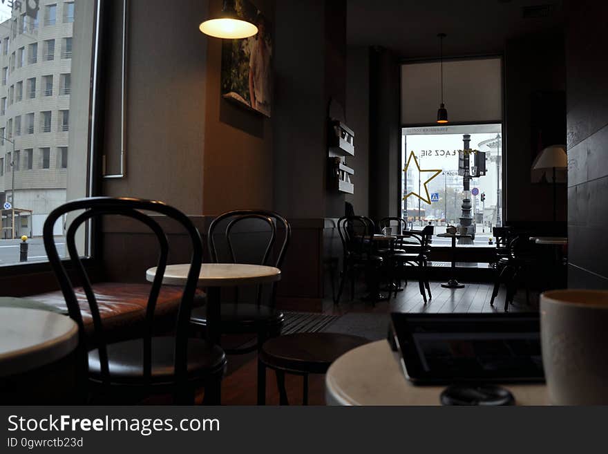 Interior of empty restaurant or cafe with tables and chairs. Interior of empty restaurant or cafe with tables and chairs.