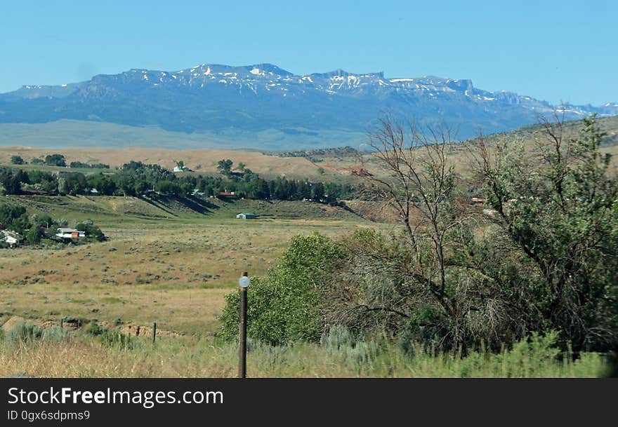 Rural landscape and mountains in the background.