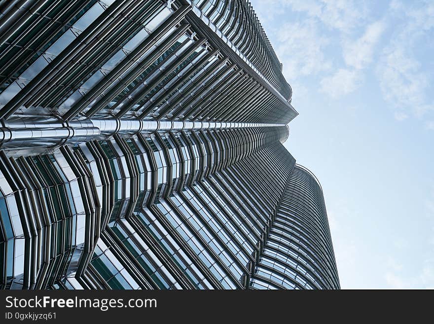 A view of a skyscraper from the street level. A view of a skyscraper from the street level.