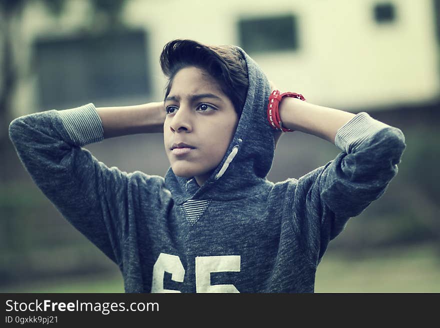 A boy wearing a hoodie. A boy wearing a hoodie.