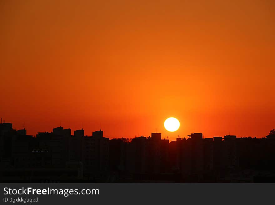 Silhouette Cityscape Against Romantic Sky at Sunset