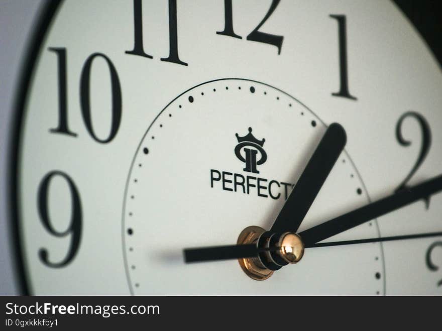 Close up of Perfect clock face with black hands. Close up of Perfect clock face with black hands.