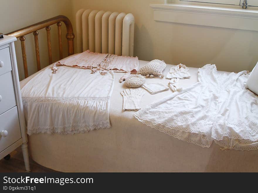 White Sleeveless Dress on White Mattress