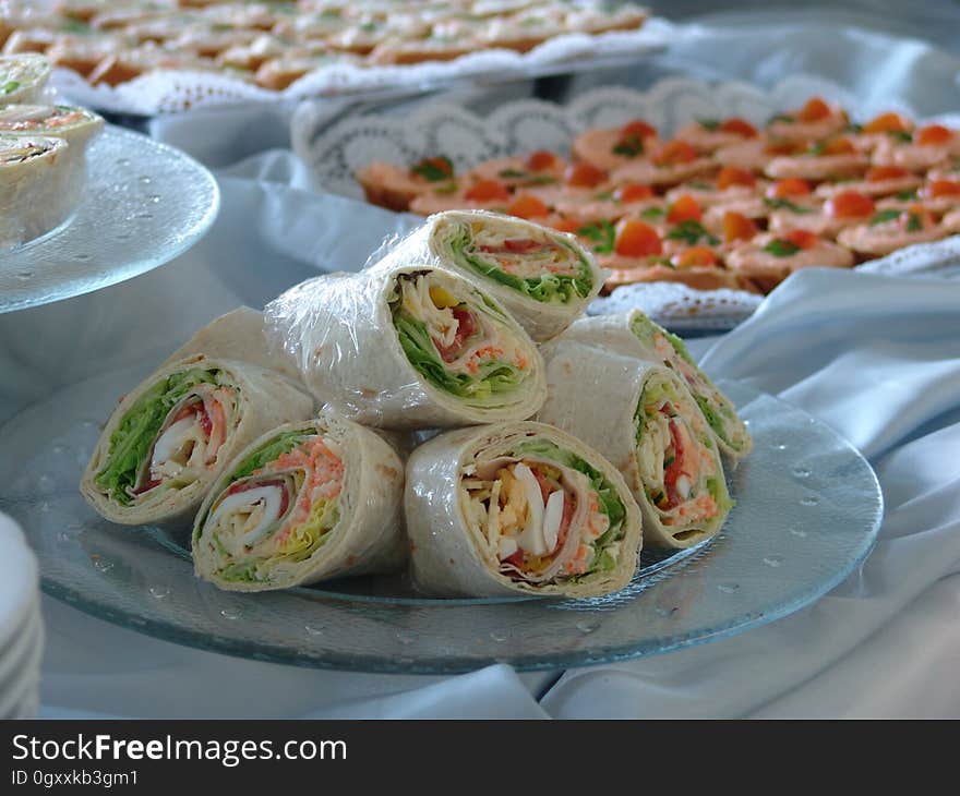 A table set up for party with different appetizers and snacks. A table set up for party with different appetizers and snacks.