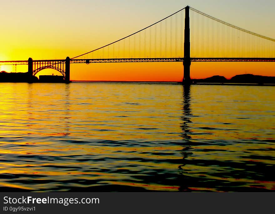 The Golden Gate Bridge is a suspension bridge spanning the Golden Gate strait, the mile-wide, three-mile-long channel between San Francisco Bay and the Pacific Ocean. The Golden Gate Bridge is a suspension bridge spanning the Golden Gate strait, the mile-wide, three-mile-long channel between San Francisco Bay and the Pacific Ocean.