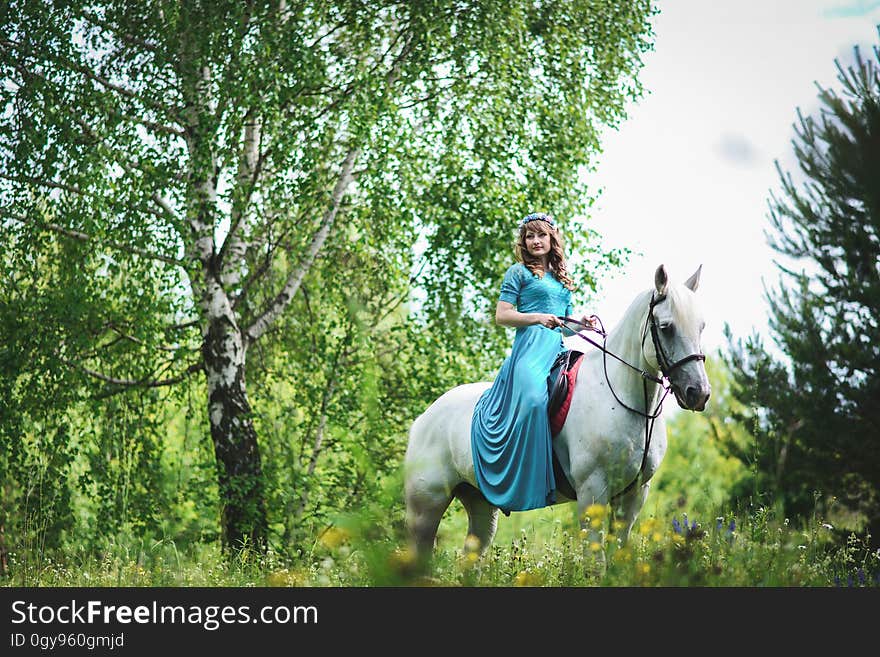 Woman in White Horse Inside Forest