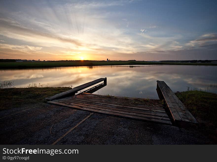 The sun sets while overlooking the water runway at Hooks Airport. The sun sets while overlooking the water runway at Hooks Airport.