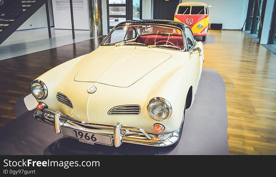 A classic Volkswagen automobile in a museum.