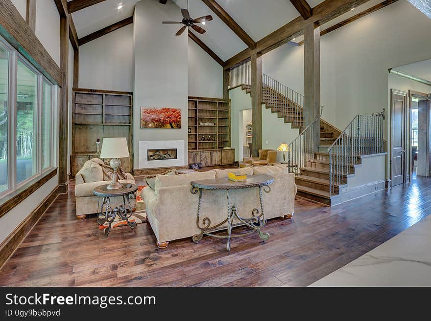 Contemporary living room interior in home with hardwood floors on sunny day.