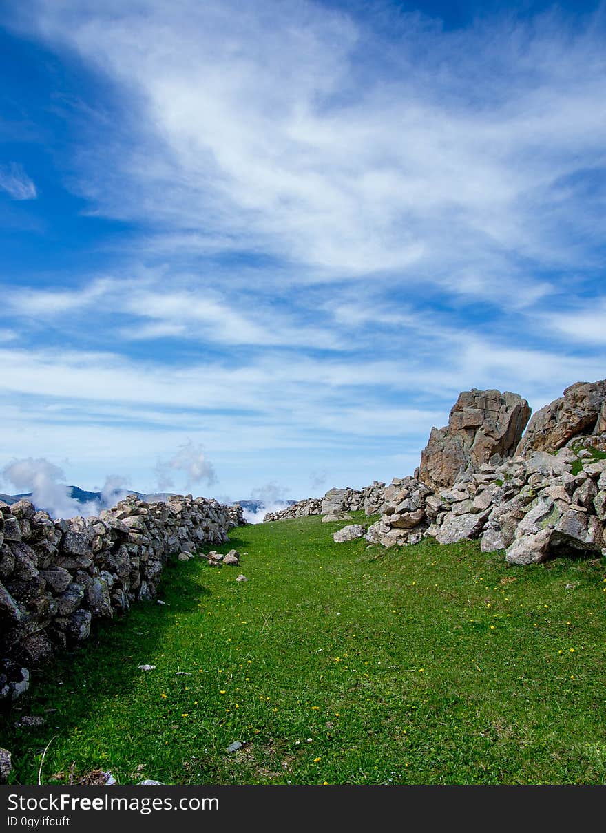 A stone wall in the countryside.