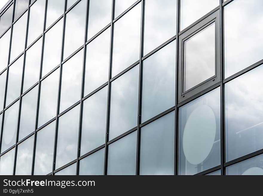 The exterior wall of a building with glass panels. The exterior wall of a building with glass panels.