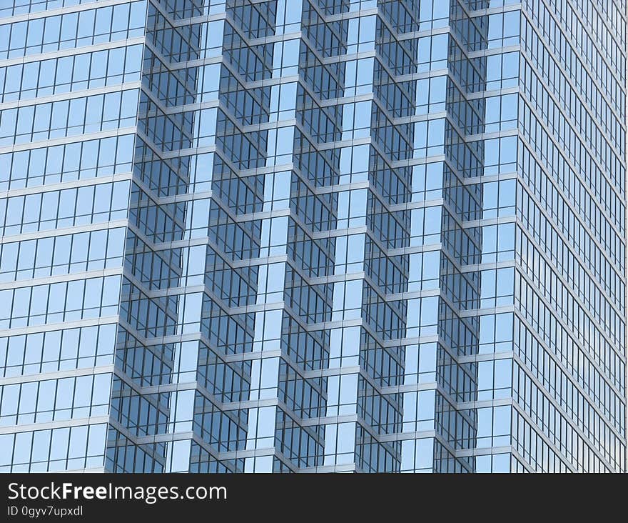 A contemporary skyscraper made of glass. A contemporary skyscraper made of glass.