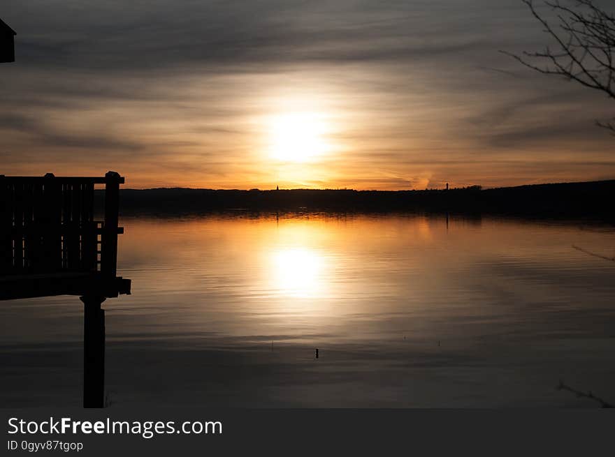 A sunset over a lake. A sunset over a lake.