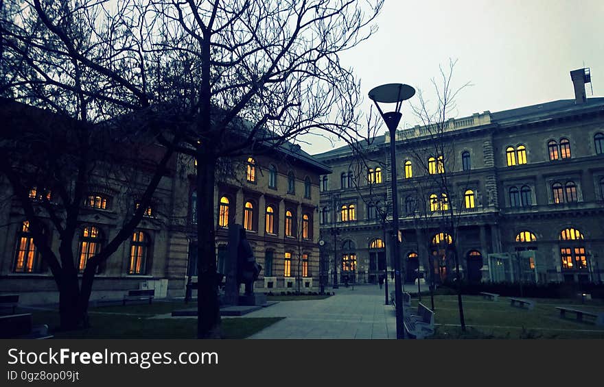 A gloomy house in the city at dusk.