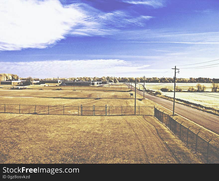 Dry grass fields with blue skies.