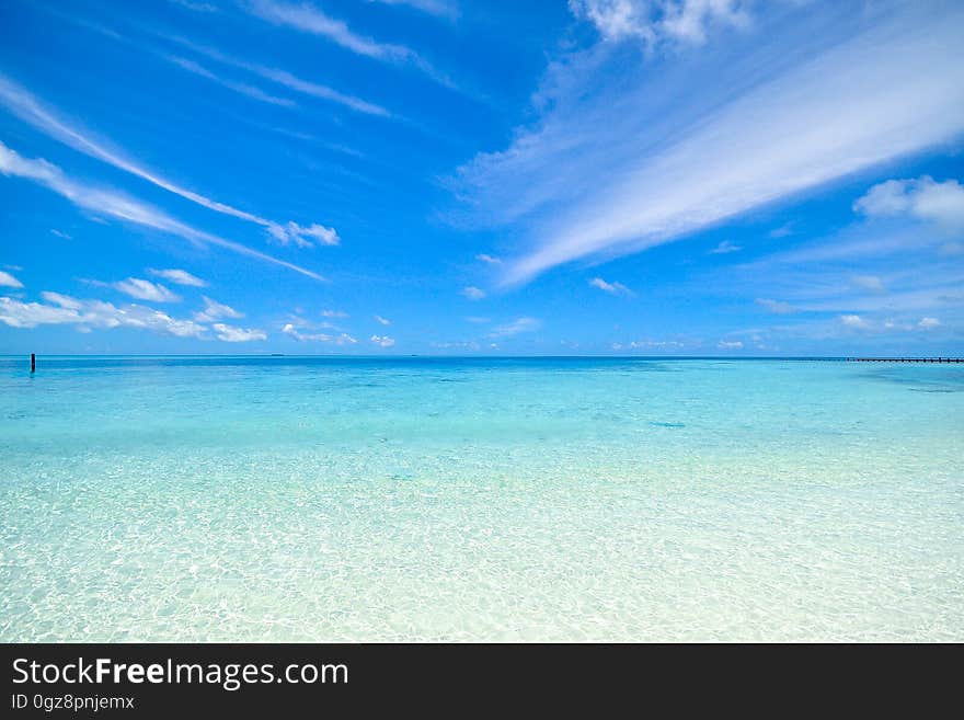 A view of a tropical sea with blue skies.