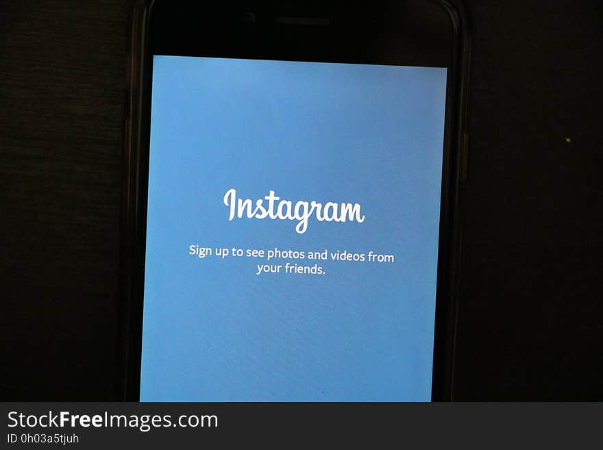 Closeup of an Instagram application on black background.