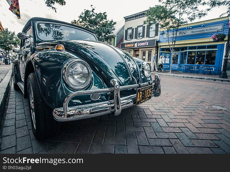 Vintage car parked on street outside shops in Annapolis, Maryland. Vintage car parked on street outside shops in Annapolis, Maryland.