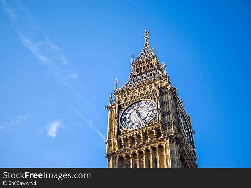 Low Angle View of Clock Tower Against Blue Sky