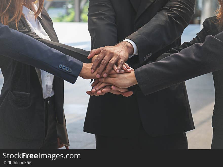 Group Of Business People Joining Hands.