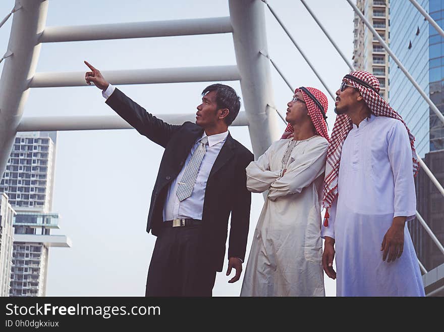 Businessman and Arab businessmen worker on construction site.