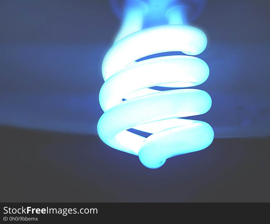 A glowing fluorescent light bulb.