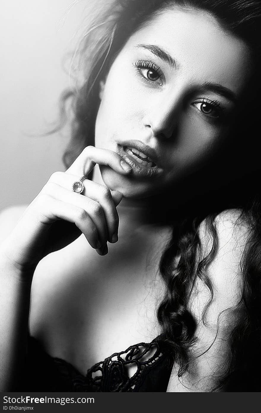 A black and white portrait of a woman with a sensual expression. A black and white portrait of a woman with a sensual expression.