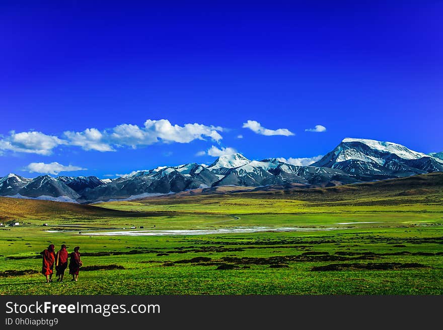 Scenic View of Mountains Against Blue Sky