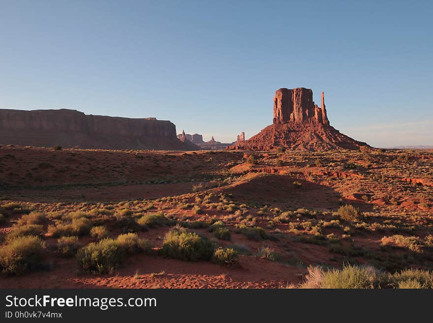 Desert landscape with rock formations in Monument Valley, Utah, USA. Desert landscape with rock formations in Monument Valley, Utah, USA.