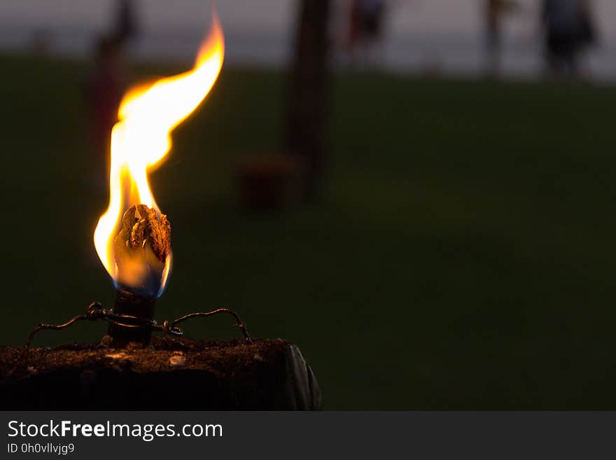 Close up of flame burning on match or candle. Close up of flame burning on match or candle.