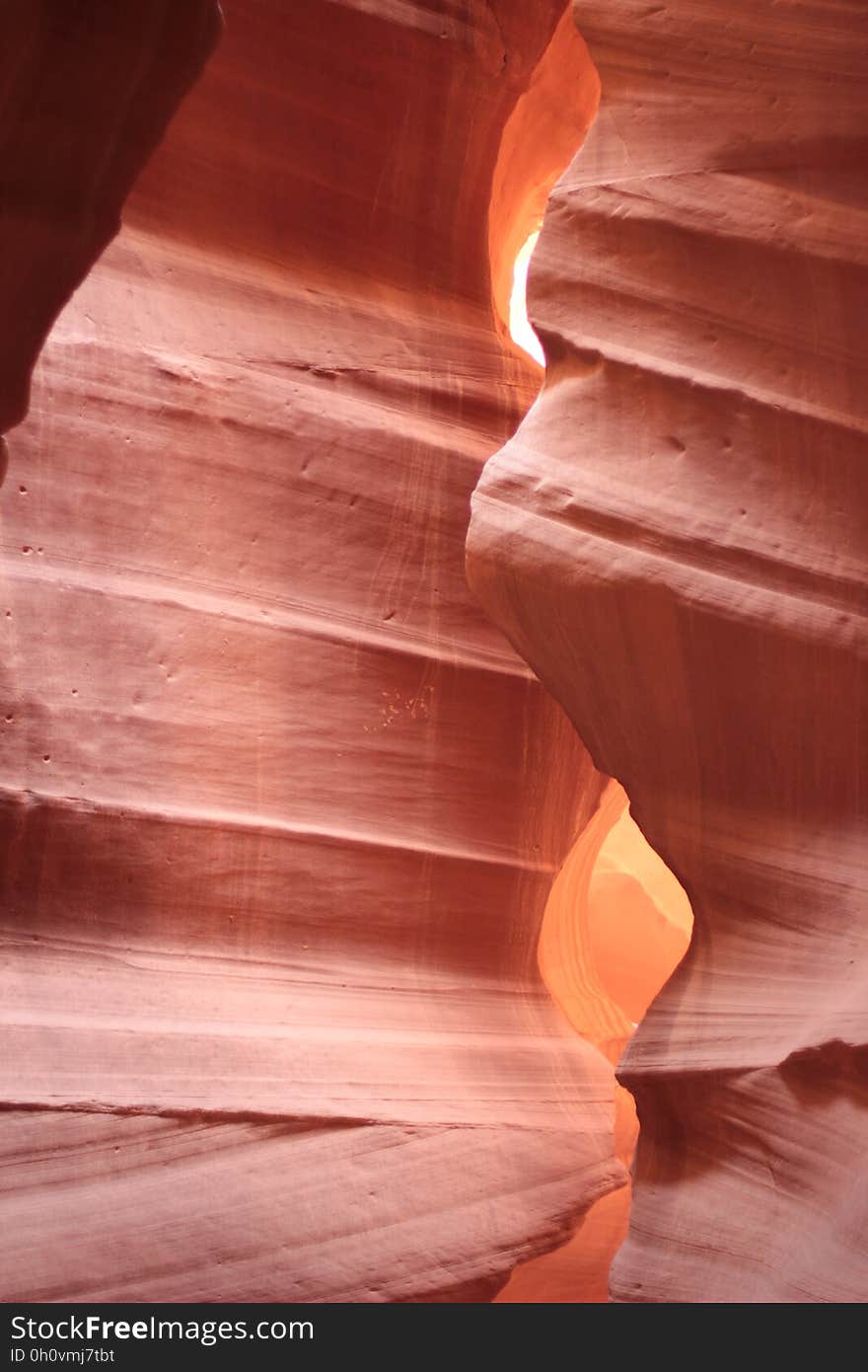 A view inside a slot canyon carved in red sandstone.