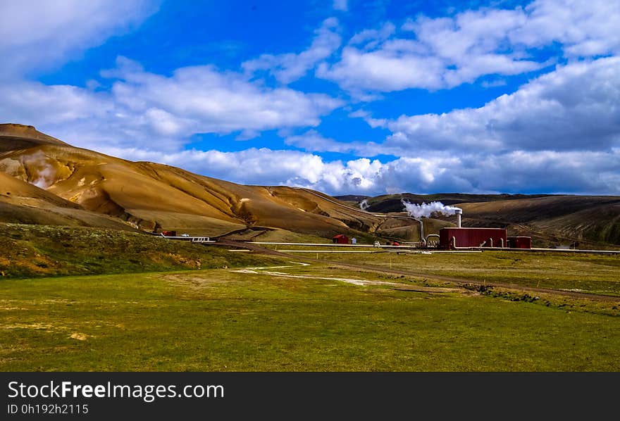 A landscape with green hills and fields. A landscape with green hills and fields.