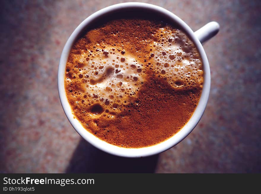 Overhead view of cup with foaming coffee or cocoa. Overhead view of cup with foaming coffee or cocoa.