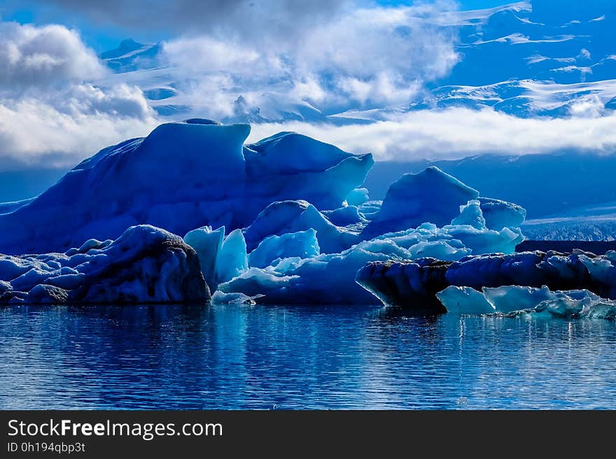 A glacial ice formation on the shore of the sea.